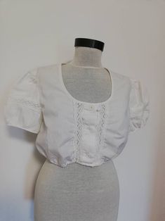 Beautiful crop top very good condition, like new fits a modern M. Vintage Crop Dirndl Top, White Trachten , Oktoberfest Clothing, you can style  it in am eclectic outfit as it is or with a Bavarian dress.  Shoulders 40cm Minimum underbust waist 68CM Maximum 106 cm elasticated waist.  Need more measurements? Just contact me and I will be happy to help. Fitted Cropped Shirt For Summer Daywear, White Fitted Cropped Shirt For Daywear, Fitted Cropped Shirt For Daywear, Fitted Cotton Cropped Shirt For Daywear, Cropped Cotton Shirt For Daywear, Fitted Crop Top For Daywear, Cotton Crop Top With Short Sleeves For Daywear, Eclectic Outfit, Austrian Fashion