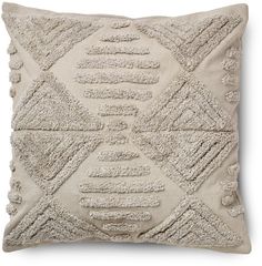 a beige pillow with an intricate design on it