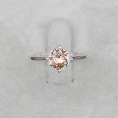 Morganite Ring, round cut stone Peach Morganite ring gift for Women, lab Morganite Ring Birthstone Ring Gemstone Ring  Sterling Silver Ring                                                                                                       Item Description :- Stone :- lab Morganite Stone Size :- 7 MM Stone Shape :- round  Metal :- Sterling Silver Purity :- 925 For more items :- https://www.etsy.com/in-en/shop/Rajasthanjewelleres?ref=seller-platform-mcnav Payment Policy We accept payment through PayPal. All payments must be made within 7 days of purchase. If you are experiencing some difficulty in paying through PayPal and need additional time, please contact us. Shipping Policy All Item will Be Shipped Through India Post International, DHL eCommerce or UPS within 1-3 Business Days after Morganite Gemstone Diamond Ring, Morganite Diamond Ring With Gemstone, Eco-friendly Morganite Diamond Ring, Diamond Ring With Round Gemstone For Promise, Diamond Promise Ring With Round Gemstone, Morganite Diamond Ring With Center Stone In Round Cut, Classic Morganite Round Cut Rings, Morganite Round Cut Diamond Ring With Center Stone, Morganite Diamond Ring With Center Stone, Round Cut