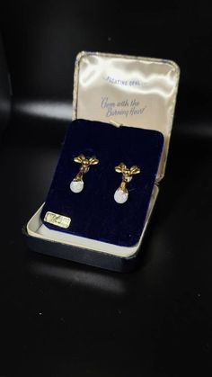 Beautiful Rare vintage Bow style floating opal earrings. Earrings are gold filled(stamps). Earrings are screwball. Original vintage case included! 100percent Genuine opal Any questions or concerns please let us know. Australian Opal Pendant, Bow Style, Opal Earrings, Australian Opal, Opal Pendants, Screw Back Earrings, Opal Necklace, Aurora, Screw