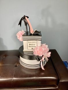 there is a shoe and bag on top of a stool with flowers in the corner