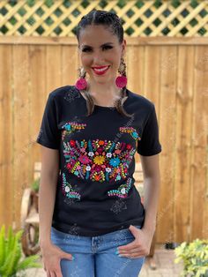 This Beautiful Floral embroidered t-shirt is made out of soft cotton and is perfect for every day use. It is cute, comfortable, and versatile. This Mexican T-shirt is hand embroidered and made with love by Mexican Artisans in Guanajuato, Mexico. Purchase the Artisanal Earrings here: https://www.etsy.com/es/listing/918692155/aretes-mexicanos-de-corazon-con-flor-de?ref=listings_manager_grid Traditional Crew Neck Top For Festivals, Bohemian Crew Neck Top For Festivals, Summer Multicolor Embroidered Short Sleeve T-shirt, Summer T-shirt With Multicolor Embroidery, Summer T-shirt With Multicolor Embroidery And Short Sleeves, Multicolor Floral Embroidery T-shirt For Summer, Festival Cotton Crew Neck Top, Cotton Crew Neck Top For Festivals, Bohemian T-shirt With Floral Embroidery And Short Sleeves