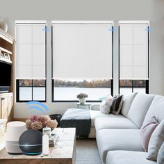 a living room filled with furniture and windows covered in white blinds, along with a flat screen tv