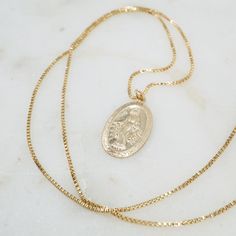 Our classic large Mother Mary pendant on a toddler strong chain - our classic 14/20 gold filled box chain, for the un-delicate wearers. Length: 20" Material: 14/20 Gold-Filled Charm Size: 12x24mm Gold Sterling Silver Charm Necklace With Box Chain, Gold Plated Curb Chain Charm Necklace Gift, 14k Yellow Gold Charm Necklace With Box Chain, 14k Gold Medallion With Box Chain, Gold 14k Gold-filled Curb Chain Jewelry, Classic Charm Necklaces With Box Chain As Gift, 14k Gold Charm Necklace With Box Chain, 14k Gold Medallion Necklace With Box Chain, 14k Gold-filled Box Chain Necklace