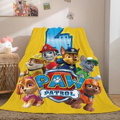 the paw patrol blanket is on the floor