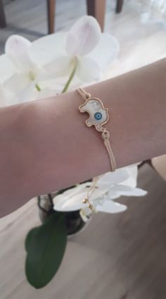 A simple beige string evil eye of protection bracelet has been hand crafted with a macrame sliding opening and closure making it one size fits all. The elephant evil eye of protection is said to protect its wearer from the negativity of others. High quality tarnish resistant rose gold plated. Charm bracelet is a nice Christmas gift,Valentine's day gift,birthday gift,wedding gift,bridesmaid gift and other special day gift for her. *Handmade, carefully crafted with passion. * Evil eye bracelet is very simple and stylish, *Made to order, Beige Jewelry Gift With Sliding Knot, Beige Bracelet With Sliding Knot As Gift, Beige Sliding Knot Bracelet As Gift, Beige Sliding Knot Bracelet For Gifts, Beige Sliding Knot Bracelet Gift, Eye Of Protection, Tiny Bracelet, Best Friend Bracelet, Friend Bracelet