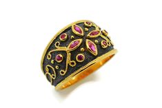 The beauty of Byzantine style jewelry, completely handcrafted in Greece with the old-fashioned way, is omnipresent. An outstanding 18K solid yellow gold ring with Byzantine design decorated with genuine rubies and black rhodium remains a classic and elegant choice for everyone. Bold and traditional, you will not take your eyes over your finger. Neither will your friends! High Quality Handmade Greek jewelry! This is a stunning ring that works well for all occasions, styles, and ages. You will lov Traditional Black Wedding Rings, Ceremonial Heirloom Ruby Ring With Intricate Design, Byzantine Style Historical Wedding Jewelry, Traditional Jewelry With Historical Design, Traditional Historical Design Ring, Byzantine Wedding Rings With Intricate Design, Traditional Ring With Historical Design, Wedding Rings With Byzantine Intricate Design, Traditional Jewelry Ring With Historical Design