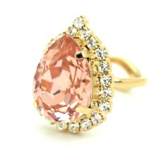 "Blush Ring, Swarovski Crystal Ring, Cocktail Ring, Swarovski Crystal Ring, Statement Ring, Gift for her, Blush Ring, Adjustable Gold Ring IF YOU WANT THE BEST CHOSE THE ORIGINAL Petite Delights is an Official SWAROVSKI® Branding Partner Official Swarovski Elements® Partner Made with real genuine high quality Austrian Swarovski ©Crystal . Our brand is legally licensed & authorized By Swarovski Company for high quality manufacturing. This pair comes with Swarovski genuine tag , this is unique Elegant Pink Teardrop Ring, Glamorous Rose Gold Wedding Ring, Elegant Peach-colored Ring, Elegant Peach Colored Ring, Elegant Peach Ring, Elegant Peach Colored Ring Jewelry, Elegant Peach Ring Jewelry, Elegant Teardrop Rings For Party, Elegant Pink Crystal Ring For Party