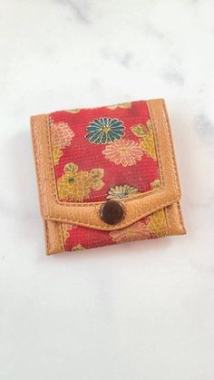 "This is a vintage leather Hato Hasi coin purse with a button snap. Hallmarks: Hato Hasi Measures 3\" x 3\" Weighs .5 oz. All measurements are approximate.  Condition: Good vintage condition. Normal wear associated age. A few light surface scratches and slight discoloration. Pouch has a distinct perfume smell. Please see photos. Sold as is. Priced accordingly.  Please look over carefully and inspect any and all photos. Our shop is committed to fully disclosing all items' conditions and history with as great of detail as possible.  Please keep in mind; what constitutes as new or unused condition for older era jewelry differs from non-vintage pieces; please consider this when examining all items in our shop. Simple wear and tear is normal for all vintage pieces. I will refund any shipping ov Retro Bifold Wallets With Coin Pocket, Retro Wallets With Coin Pocket For Daily Use, Vintage Trifold Wallet With Coin Pocket For Travel, Retro Wallet With Coin Pocket For Daily Use, Travel Bifold Coin Purse With Snap Closure, Rectangular Trifold Wallet With Snap Closure As Gift, Vintage Travel Wallets With Coin Pocket, Vintage Travel Wallet With Coin Pocket, Vintage Red Bifold Wallet