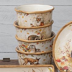 a stack of dishes sitting on top of a wooden table