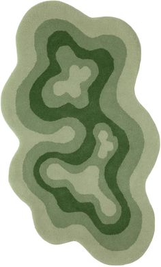 a green rug with wavy shapes on it