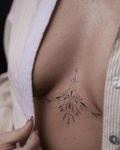 a woman with a tattoo on her chest