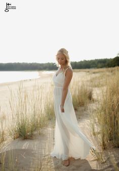 SUNRISE White flowy dress with straps | Maternity dress for photoshoot and wedding | Elopement boho dress for photography |Jenny Aarrekangas SUNRISE is a white flowy romantic dress for photography and boho weddings.  It is the perfect summer dress for maternity photography.  When shooting the maternity dress in backlight, you can see the beautiful silhouette through the fabric. It is also a lovely dress for an elopement photoshoot on the beach or as a boho dress for special occassions. The spagh Flowy Summer Bridesmaid Gown, Ethereal White Maxi Dress For Wedding, Ethereal White Wedding Maxi Dress, Summer Beach Gown Flowy Fit, Summer Bridesmaid Floor-length Wedding Dress, Summer Floor-length Bridesmaid Wedding Dress, Summer Beach Wedding Maxi Gown, Summer Bridesmaid Wedding Dress, Ethereal Summer Bridesmaid Dress