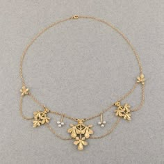 Very lovely antique necklace, made in France circa 1900, Art Nouveau era and design. The length is 40.5 cm long or 16.2 inches. Made in yellow gold 18k and pearls. Eagle head mark for gold 18k. The central motif measures 34*25 mm. The two others mains parts measures 26*19 mm. Total weight 17.90 grams. In good condition. Victorian Pearl Chain Necklace For Formal Occasions, Antique Formal Pearl Chain Necklace, Antique Pearl Chain Necklace For Formal Occasions, Victorian Pearl Necklace For Formal Occasions, Victorian Style Formal Pearl Necklace, Antique Yellow Gold Necklace With Historical Design, Victorian Pearl Necklace With Pearl Pendant, Elegant Yellow Gold Necklace With Historical Design, Art Nouveau Yellow Gold Necklace For Formal Occasions