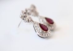 Metal: 14kt White Gold Stone: Diamond And Ruby Shape: Round And Pear-shape Ruby Weight : 1.00 ctw Diamond Weight: .52 ctw Type Of Backing: Post Weight of entire piece: 5.60 grams Dimensions of Earrings From Top To Bottom: 24.22mm Customizable: We can custom make these earrings (and its matching necklace) with any gems and metals of your choice. Please inquire if interested. Matching Necklace: https://www.etsy.com/listing/549448744/vintage-style-14k-white-gold-ruby-and?ref=shop_home_active_2 Amethyst And Diamond Ring, Vintage Style Earrings, Filigree Design, Gold Stone, Gold Dipped, Matching Band, Style Earrings, Matching Necklaces, Vintage Diamond