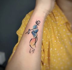 a woman's arm with a tattoo on it that has an image of a person dancing