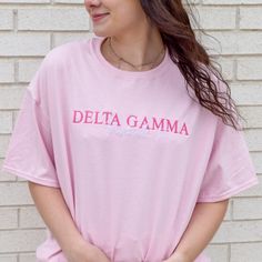 Your summer nights just got cuter! This classic tee is perfect for long nights under the stars or days on the boat. This tee will have your sorority name embroidered in the thread color of your choice and the city and state will be embroidered in white. Thread color will be for the sorority - the city and state will be in white no matter what shown in light pink and cornsilk 6 oz.(US) 10 oz.(CA), 100% preshrunk cotton Classic fit 7/8" double-needle topstitched collar Taped neck and shoulders Dou Pink T-shirt With Embroidered Text For Summer, Pink Embroidered T-shirt For Summer, Pink Sorority T-shirt For Spring, Pink Sorority T-shirt For Summer, Sorority Cotton T-shirt For Spring, Spring Sorority Cotton T-shirt, Sorority Style Cotton T-shirt For Spring, Pink Sorority T-shirt With Crew Neck, Summer Sorority Cotton T-shirt