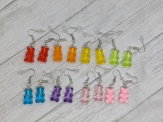 Add some fun to your jewelry collection with these cute earrings. Made with stainless steel hooks and silicone backings, these earrings are safe for sensitive skin. Free shipping on all orders over $35 Browse the rest of my shop here: https://www.etsy.com/shop/laceycakesnc Gummy Bear Earrings Outfit, Gummy Bear Beaded Necklace, Gummy Bear Necklace, Gummy Bear Accessories, Gummy Bears Earrings, Gummy Bears, Etsy Earrings Dangle, Cute Earrings, Sensitive Skin