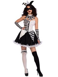 a woman in a costume that is dressed up like a cat with black and white checkered