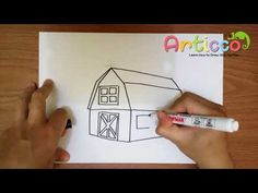 someone is drawing a house on paper