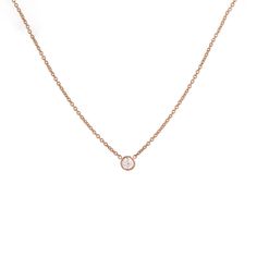 Our classic 14k gold pendant necklace features a solitaire round brilliant diamond, bezel set and suspended from a dainty chain - a subtle yet timeless sparkle from Gilded by G.St. Able to special order in rose or white gold- please allow 5 weeks for production and delivery. • 14k gold• 0.20ct round brilliant diamond (G-H color, SI clarity)• Spring ring clasp• Length: 16-17" All G.St collections are designed and crafted by us in NYC using recycled gold, conflict-free diamonds and responsibly sou Elegant Diamond Necklace With Smooth Bezel For Gift, Elegant Diamond Necklace With Smooth Bezel, Minimalist Diamond Solitaire Necklace With Smooth Bezel, Elegant Solitaire Necklace For Anniversary With Smooth Bezel, Elegant 14k Gold Necklace With Smooth Bezel, Rose Gold Solitaire Necklace With Bezel Setting For Anniversary, Rose Gold Diamond Necklace With Bezel Setting, Rose Gold Bezel-set Solitaire Necklace For Anniversary, Rose Gold Diamond Necklace With Single Round Cut