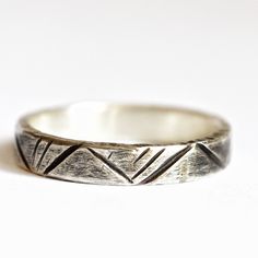 "Wedding rings for mountain lovers, unique rustic ring perfect for engagement or anniversary rings.  Minimal and unique rings, they will remind you of your love and passion for the mountains.  Keep in mind that all of my items are handmade. Any small imperfection you may find in them shows the and their artistic uniqueness. If you want an engraving in the inner ring, max 20 character, please select the option \"engraved ring\". Please, before buying, check your size carefully with a ring similar to this one. To be sure, measure the inside diameter of a similar ring and compare it with the diagram in the picture above. If you can, send me the internal diameter of your ring. If you have any doubts contact me, I will be happy to help you. DETAILS § Sterling Silver   §  Approximately mm wide 4 Rustic Ring For Anniversary, Rustic Anniversary Jewelry Ring, Rustic Hand Forged Wedding Rings, Rustic Hand Forged Rings For Anniversary, Rustic Hand Forged Promise Ring, Rustic Silver Wedding Rings, Minimalist Etched Rings For Promise, Rustic Sterling Silver Rings For Anniversary, Rustic Silver Promise Ring