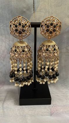 Jimikee's collection products are preferred by many TV Artists. So affordable to buy. These earrings are perfect for Wedding and Parties and even for Daily wear, College wear and Office wear. So Elegant to wear. Earring Length: 7.9 cm Width: 3.5 cm Weight: 1.5 Oz Bollywood Style Jhumkas With Dangling Beads For Party, Traditional Beaded Chandbali Danglers, Traditional Beaded Chandbalis For Festive Occasions, Chandbali Beaded Danglers For Festivals, Bollywood Style Dangling Beads Jhumkas For Party, Beaded Chandbali Danglers For Festivals, Traditional Festive Beaded Earrings With Dangling Beads, Traditional Beaded Chandelier Earrings For Festive Occasions, Bollywood Style Festive Beaded Earrings