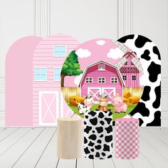 there is a pink barn with black and white animals on it's farm scene