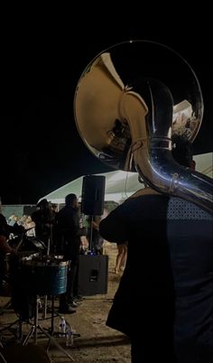 the band is playing in the dark with their instruments