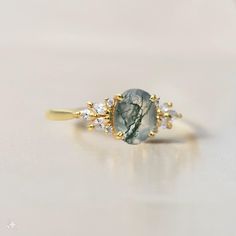 Moss agate ring, Moss agate engagement ring sterling silver, Moss agate promise ring, Emerald Cut green moss agate ring, Anniversary gift for her About Ring:- Gemstone - NATURAL MOSS AGATE Gemstone size - 6x8 mm Gemstone Shape - Oval Cut Metal - 925 Sterling Silver/ 14k Solid Gold or 18k Solid Gold Setting Type - Prong Theme - Wedding Ring / Engagement Ring : We are manufacturers of natural gemstones and have specialized in jewelry designing and working in this field for many years. Now we want to take this business to another level, so give us a chance to provide you with genuine products and the price worthy of that product. our gemstones are 100% natural and also provide a certificate on demand. Give us your valuable feedback after you get the item. Thank You Green Moss Agate Ring, Oval Moss Agate Ring For Anniversary, Oval Moss Agate Gemstone Ring, Adjustable Oval Rings With Gemstone Accents, Elegant Agate Open Ring, Elegant Oval Moss Agate Rings, Elegant Oval Agate Jewelry, Oval Agate Wedding Rings, Moss Agate Round Promise Ring