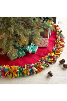 a christmas tree skirt with presents on it