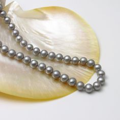 8mm Grey Color Round Pearl Necklace Genuine Freshwater Cultured Pearl Necklace for Women and Men Real Pearls Gift for her Gift for him PRODUCT INFORMATION: * Pearl Type: Genuine freshwater pearls with natural luster. * Pearl Color: See photo. * Pearl Shape and Size: Round freshwater pearls, 8-8.5mm  * Pearl Luster: Very Slightly blemished. * Necklace Length: available in 16", 17" and 18".  If you require other length please contact us. * Clasp: Base metal with Rhodium plated. PROCESSING TIME & S Pearl Gifts, Black Pearl Necklace, Cultured Pearl Necklace, Real Pearls, Wedding Jewellery Necklace, Pearl Types, Pearl Choker, Freshwater Pearl Necklaces, Pearl Color