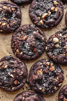 chocolate cookies with nuts and sea salt on a baking sheet, ready to be eaten