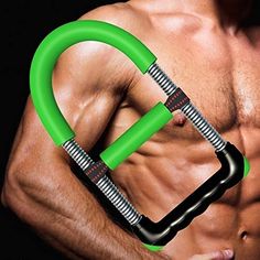 a shirtless man holding a green exercise ring in front of his chest and arms