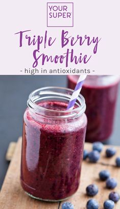 purple smoothie in a jar with blueberries on the side