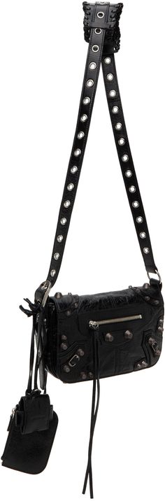 Crinkled Arena lambskin shoulder bag in black. · Pin-buckle shoulder strap · Detachable zip pouch at shoulder strap · Detachable mirror at shoulder strap · Studs and pin-buckle straps at face · Zip pocket at face and back face · Bumper studs at base · Foldover flap · Magnetic closure · Zip pocket at interior · Cotton canvas lining · Antiqued silver-tone hardware · H5.25 x W9.5 x D1.5 in Supplier color: Black Luxury Crossbody Baguette Bag With Silver-tone Hardware, Everyday Crossbody Baguette Bag With Silver-tone Hardware, Everyday Use Baguette Bag With Silver-tone Hardware, Everyday Baguette Crossbody Bag With Silver-tone Hardware, Silver-tone Hardware Baguette Crossbody Bag For Everyday Use, Baguette Bag With Palladium Hardware For Travel, Luxury Baguette Bag With Metal Hardware, Black Baguette Crossbody Bag With Silver-tone Hardware, Designer Black Baguette Bag With Adjustable Strap