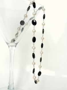 "Black white necklace, genuine pearls and black agate, wire wrapped, 18-20\", Argentium and sterling silver, handmade, Let Loose Jewelry Classic piece to add to your collection~ this adjustable handmade necklace features alternating faceted black agate ovals and smooth white 6mm pearls. The graphic contrast of these black and white gemstones is always in style. I've used Argentium silver on the wire work and finished it with sterling- an 11mm lobster clasp and extension chain allowing you to adj Elegant Onyx Wire Wrapped Necklace, Elegant Silver Pearl Necklace With Black Beads, Elegant Handmade Black And White Jewelry, Black Sterling Silver Pearl Necklace Gift, Gift Black Pearl Necklace In Sterling Silver, Black And White Necklace, White Gemstones, Black And White Necklaces, Phoenix Pendant