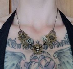 "This fun, steampunk-inspired necklace will lend an edge to any outfit. Each miniature cog was hand-selected & carefully attached to create a symmetrical collar framing my signature skull bead in the centre. Multiple finishes on the metal create a multi-layered look with lots of personality & depth! Measurements: clasp to charm: 9 1/2\" gear height: 1 1/4\"" Apache Junction, Inspired Necklace, My Signature, Bib Necklaces, Beaded Skull, Layered Look, Collar Necklace, Necklace Etsy, Jewelry Necklaces