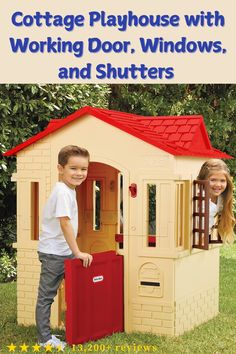 two children playing in a play house with working door, windows and shutters on the cover