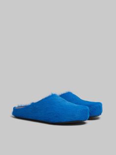 Fussbett Sabot in long hair leather. Barefoot feeling. Fussbett inner sole in leather. Ribbed rubber sole. Luxury Blue Leather Mules, Blue Leather Sole Slip-on Mules, Blue Slip-on Mules With Leather Sole, Marni Slides, Flat Heel Boots, Trunk Bag, Women Essentials, Lacing Sneakers, Boot Accessories