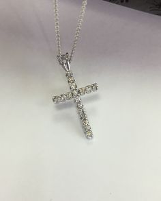 "Metal-----------14k white gold Pure gold not plated Diamond weight-------0.26CT G -----------color VS1, - VS2------- quality Length ---------5.6mm All Natural Diamonds Pendant-------Handmade in USA --14k white gold chain included Available sizes 16\" ,18\" ,20\" inches long Available in 14k yellow gold too" Classic White Diamond Necklace Hallmarked, White Sterling Silver Diamond Necklace, Classic White Hallmarked Diamond Necklace, Silver Brilliant Cut Cross Pendant Jewelry, Classic White Diamond Necklace With Polished Finish, Fine Jewelry White Diamond Necklace With Polished Finish, Platinum Diamond Necklace With Polished Finish In White Gold, White Gold Platinum Diamond Necklace With Polished Finish, Classic Hallmarked White Gold Diamond Necklace