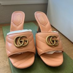 This Is An Authentic Pair Of Gucci Nappa Matelasse Gg Marmont 75mm Slide Sandals 37 In Box Pink. These Heels Are Crafted Of Leather In Pink. They Feature An Antique Gold Gg Logo, A Peep Toe, And A 3.25-Inch Block Heel. Gg Logo, Gg Marmont, Logo A, Gucci Shoes, Slide Sandals, Antique Gold, Women's Shoes Sandals, Block Heels, Shoes Sandals