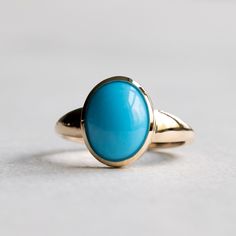 Sleeping beauty blue turquoise set on 18k yellow gold. Metal: 18k Gold Stone: Sleeping beauty turquoise Stone Shape: Oval Stone Size: 8mm x 10mm Band Width: Approx 1.4mm band width This ring is customizable with your choice of gemstones. Please contact us for custom work. LEAD TIME: Made to order will take 10-14 days. Luxury Turquoise 14k Gold Ring, Luxury Turquoise Cabochon Ring In Yellow Gold, Fine Jewelry Hallmarked Turquoise Ring In Yellow Gold, Fine Jewelry Hallmarked Yellow Gold Turquoise Ring, Fine Jewelry Turquoise Ring In Yellow Gold, Luxury Yellow Gold Turquoise Cabochon Ring, Yellow Gold Turquoise Ring With Polished Finish, Classic Yellow Gold Turquoise Gemstone Ring, Elegant 14k Yellow Gold Turquoise Ring