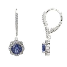 These earrings feature a beautiful floral-inspired design. Each earring has a round, lab-grown tanzanite stone surrounded by sparkling cubic zirconia forming a delicate flower. The secure latch back fastener, adorned with additional zirconia, adds extra sparkle. Tanzanite is the birthstone for December. It symbolizes transformation, intuition, and spiritual growth. The Matilda Drop Earrings make a thoughtful gift for birthdays, especially December birthdays, anniversaries, or any special occasio Elegant Tanzanite Dangle Earrings, Elegant Tanzanite Earrings With Brilliant Cut, Tanzanite Earrings With Prong Setting, Tanzanite Round Earrings For Wedding, Round Tanzanite Earrings For Weddings, Tanzanite Round Wedding Earrings, Round Tanzanite Wedding Earrings, Elegant Silver Tanzanite Earrings, Elegant Tanzanite Jewelry With Halo Design