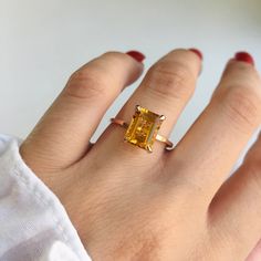 RING DETAILS: ✪Design: Gold ring ✪Gemstone: Natural yellow beryl, moissanite diamond ✪Gemstone shape: Emerald cut ✪Gemstone transparency: Transparent ✪Gemstone weight: Natural yellow beryl- 2.40 cts. ✪Setting type: Prong setting ✪Metal type: 14k solid gold ✪Gold weight: 1.81 gm ✪Metal finish: Smooth shiny ✪Total ring weight: 2.23 gm Choose your ring size from drop down menu and if you need any other preferred ring size please contact us. QUALITY OF MATERIALS: Metal: Most of our jewelry at Jewelr Citrine Promise Ring In Fine Jewelry Style, 14k Gold Radiant Cut Ring For Proposal, Emerald Cut Citrine Rings, Gold Sapphire Ring With Prong Setting For Proposal, Citrine Prong Setting Promise Ring, Radiant Cut Solitaire Topaz Ring Gift, Gold Sapphire Ring With Radiant Cut For Gift, Gold Radiant Cut Sapphire Ring Gift, 14k Gold Radiant Cut Ring Gift