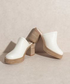 The Charleston Clogs - The Flaunt Chic Slip-on Clogs With Reinforced Heel, Trendy Mules With Wooden Block Heel, Chic Synthetic Clogs With Open Heel, High Heel Synthetic Clogs For Spring, Spring High Heel Synthetic Clogs, Trendy Slip-on Mules With Reinforced Heel, Chic High Heel Clogs With Reinforced Heel, Modern Clogs With Wooden Open Heel, Modern Slip-on Clogs With Reinforced Heel