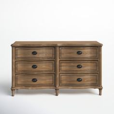 an old wooden dresser with drawers and knobs