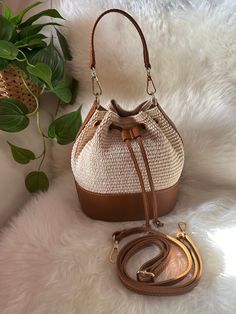 ⭐️Elegant raffia bucket bag suitable for summer. Including an adjustable genuine leather shoulder strap and also its finishes. The bag is made entirely in Italy and is handmade by local artisans. ⭐️Very good quality and beautiful to wear for an everyday look or even for summer evenings for a fresh and young look. 👜DIMENSIONS: Length 20cm Height 23 cm Thickness at the base 12 cm Vacation Hobo Bag In Beige Bucket Style, Vacation Beige Bucket Hobo Bag, Trendy Summer Straw Bag With Detachable Strap, Beach Season Straw Crossbody Bag With Braided Handles, Natural Hobo Bag With Adjustable Strap For Vacation, Beige Bucket Hobo Bag For Beach, Beige Straw Shoulder Bag With Adjustable Strap, Natural Hobo Crossbody Bag For Vacation, Natural Color Crossbody Hobo Bag For Summer