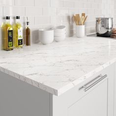 a kitchen counter top with white marble on it