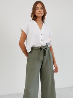 ALLIE is a pair of relaxed-fit, wide-leg cropped linen pants. They feature a high-waisted paper bag design with a self-tie belt, offering both comfort and style for a variety of occasions. DETAILS - High-rise paperbag waist - Wide-leg cut for a relaxed, flowy fit - Cropped length - Pleated front COLOR - Sage Green (featured color) - Multiple colors available in dropdown menu above - See all color options & order fabric samples here: https://www.etsy.com/listing/586569696/linen-fabric-samples SIZ Green Linen Pants, Paper Bag Design, Linen Wide Leg Pants, Pants Linen, Linen Pant, Cropped Linen Pants, Linen Crops, Uniform Fashion, Wide Leg Linen Pants